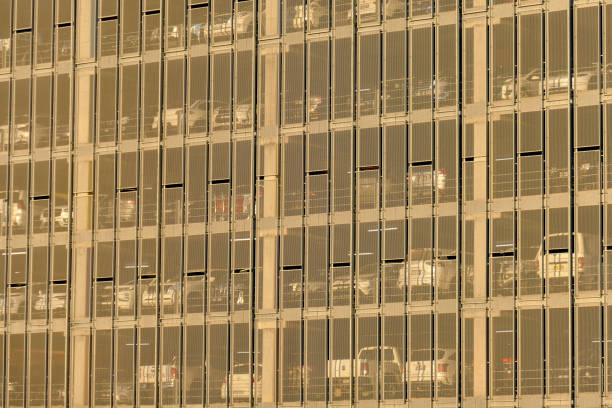 Tall building with multiple windows on a clear blue sky - Financial building wall and Sky. Business Background, Beijing