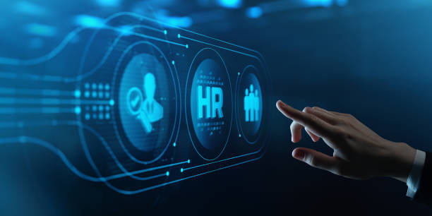 istock Human Hand Touching Futuristic Virtual Screen with HR icon. Human Resources management Recruitment Employment Headhunting Concept 2168316162