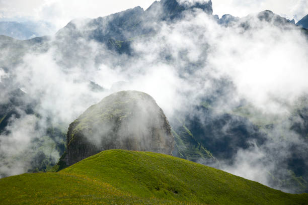istock Big rock in moutains covered by a cloud 2168328484