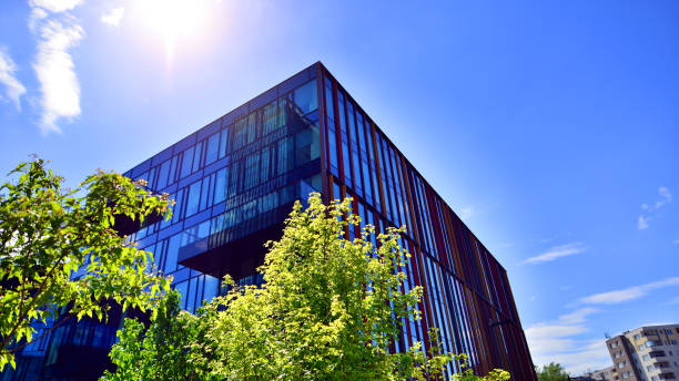 istock Sustainable glass office building with trees for reducing carbon dioxide. 2168331814