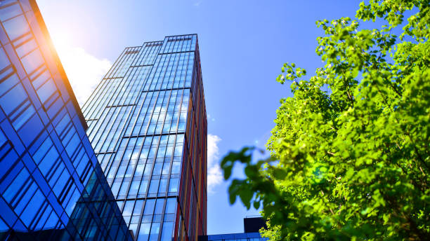istock Sustainable glass office building with trees for reducing carbon dioxide. 2168331832