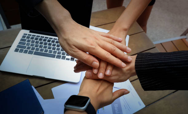 Teamwork Concept,Group of diversity people to greeting power tag team,Teamwork Join Hands Partnership Concept of people putting their hands together,Friends with hands showing unity.