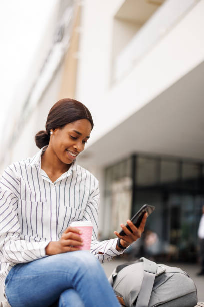 istock Scrolling through social media in the city 2168345771