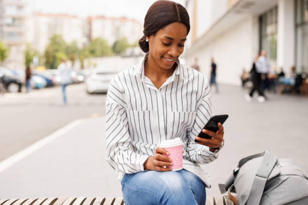 istock Scrolling through social media in the city 2168347342