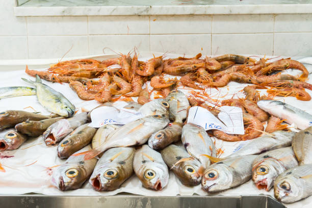 Fresh fish and shrimp displayed in a fish market in Sicily. Horizontal.