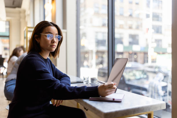Young Professional Working in Cafe Morning