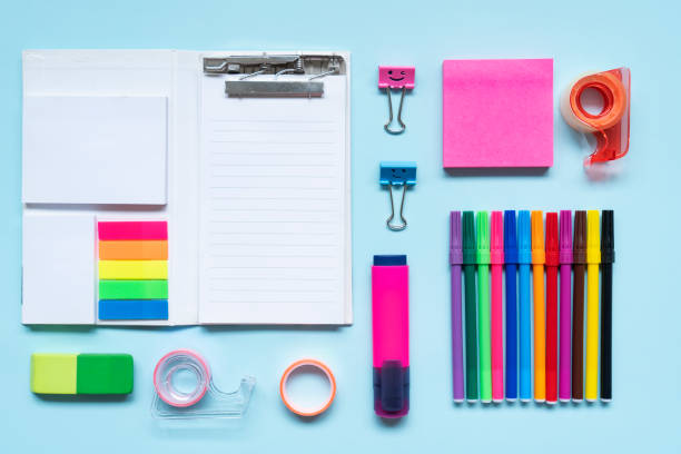 istock School and office supplies on blue background 2168351939
