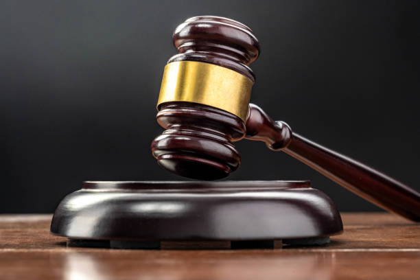 istock Judge's gavel on a table welly lit with black background 2168354669