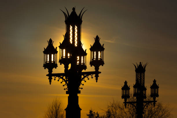 Vintage street lanterns against the sunset sky