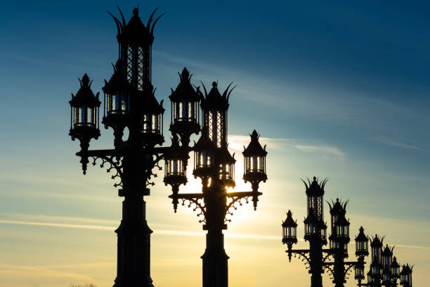 Vintage street lanterns against the sunset sky