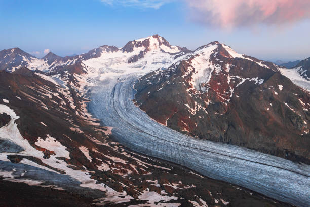 Aerial view at dawn of Palla Bianca (Weißkugel) alpine peak with the glacial tongue of Hintereis (Hintereisferner), Venosta alps (Ötztaler Alpen), Tyrol, Austria, Europe
