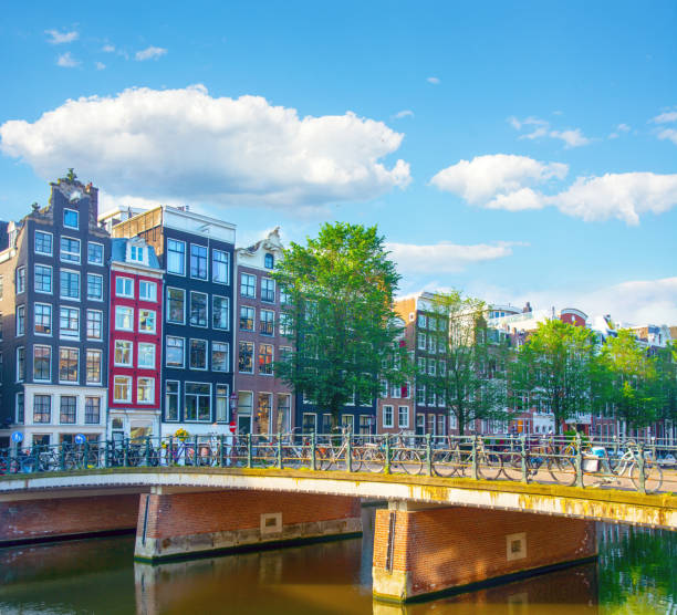 Old houses and a bridge over canal in downtown of Amsterdam, Netherlands