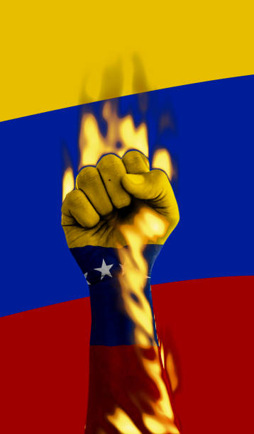 istock Fist with the venezuelan flag is burning 2168358589
