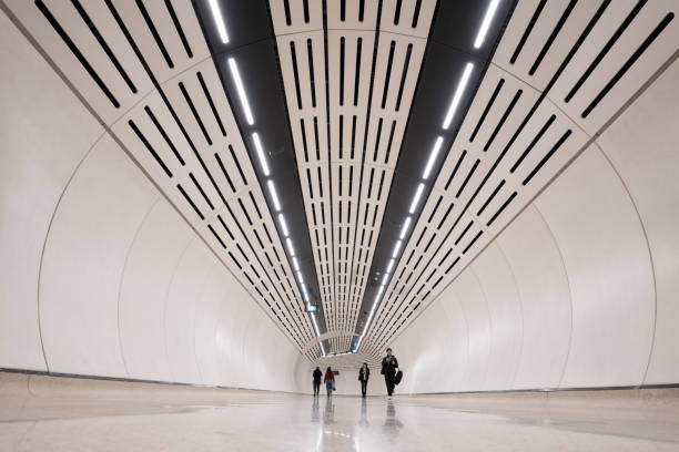 istock Obscured Inner city commuters walking through a futuristic tunnel as an example of fast pace life 2168359511