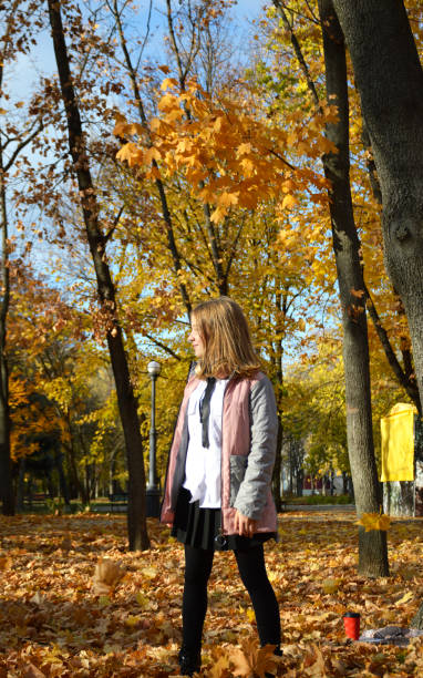 istock beautiful, cheerful girl on a walk in the autumn park 2168359607