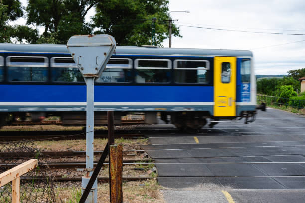 istock train crossing over railway tracks at crossing 2168362438