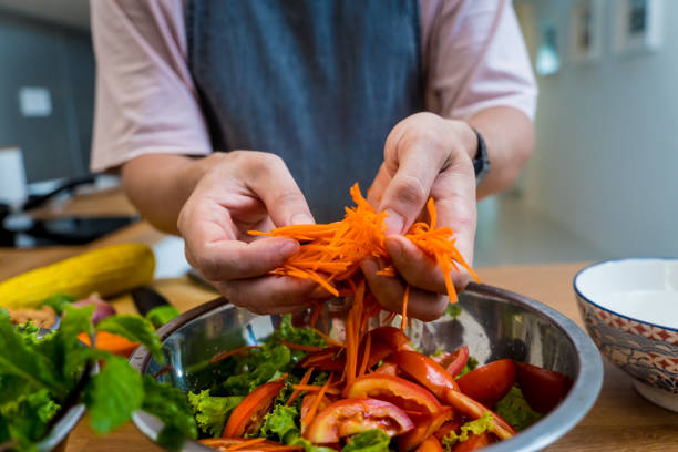 istock Chef at the kitchen preparing spicy glass noodle salad 2168365629