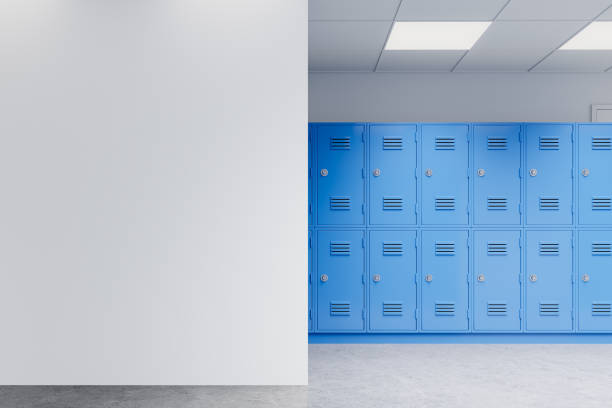 istock Blank white wall and blue lockers in a school hallway. 3D Rendering 2168366657