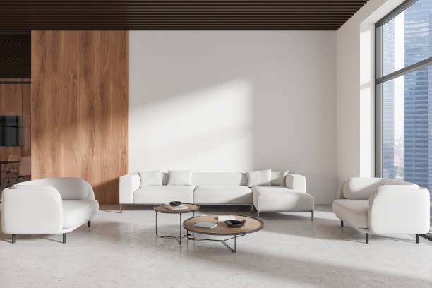 istock Stylish office lounge zone interior with soft place near window. Mockup wall 2168367186