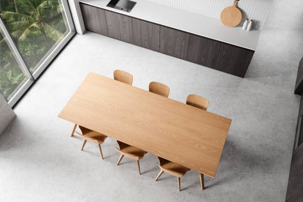 istock Top view of home kitchen interior with cooking cabinet, dining table near window 2168368082