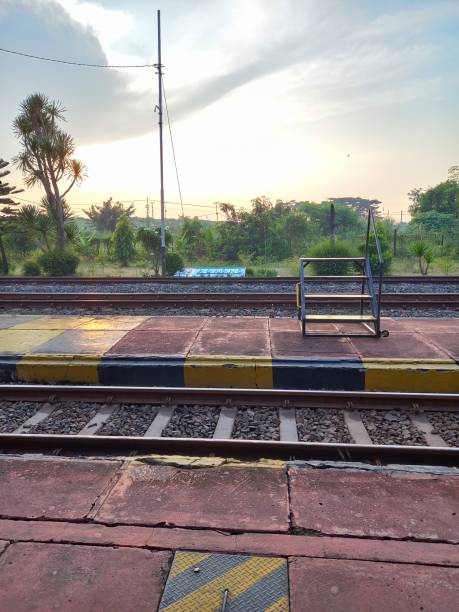 istock railroad track with yellow barriers around it 2168368164