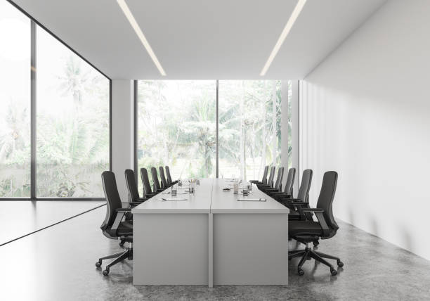 istock White meeting room interior with board and chairs, panoramic window 2168368217
