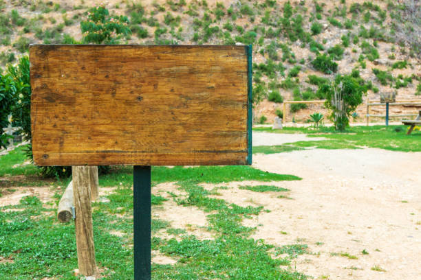 istock Empty weathered wood sign in the countryside. 2168369598