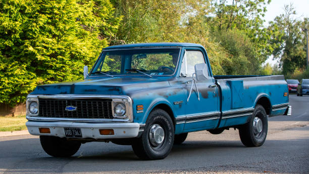 Whittlebury,Northants.,UK - Aug 25th 2024: 1971 Chevrolet pickup truck driving on a British country road.