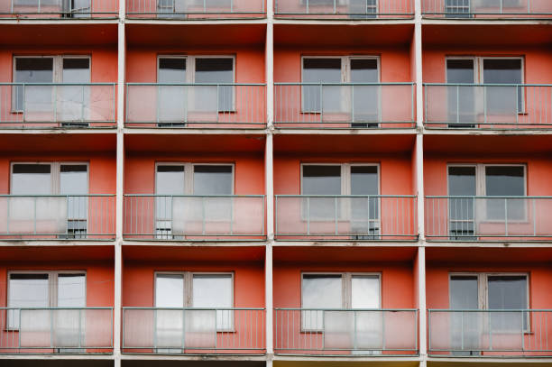 istock rows of red balconies on apartment building 2168375291