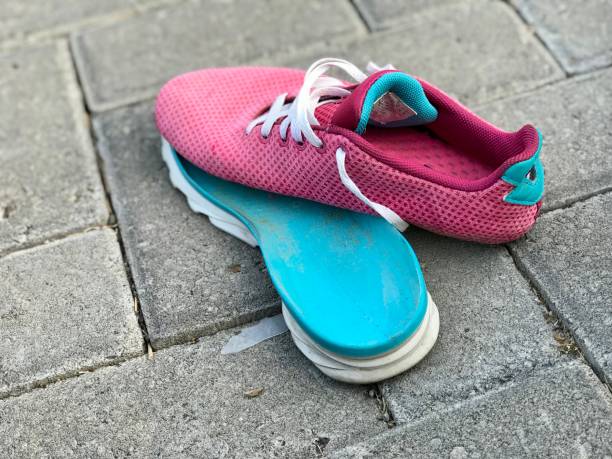 istock A pink sneakers with the soles off. 2168377510