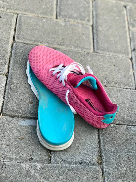 istock A pink sneakers with the soles off. 2168377568