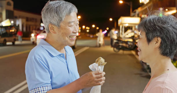 istock elderly couple eat fried chicken 2168379358