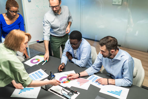 istock Business team working on new project using laptops, white board, diagrams 2168381075