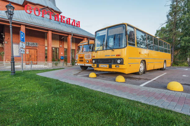 Sortavala, Russia - August 07, 2022: Retro buses by the railway station building.