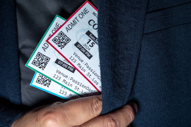 istock Close-up of a hand taking three tickets from a pocket,Ticket Scalping concept 2168385802
