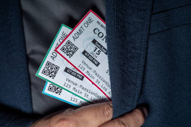 istock Close-up of a hand taking three tickets from a pocket,Ticket Scalping concept 2168385849