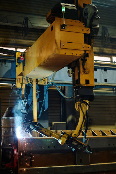 istock Robotic Arm Welding Metal Component in Factory Setting 2168386310