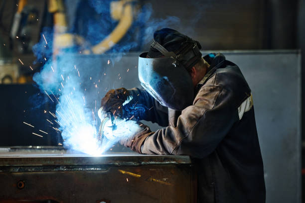 istock Performing Metal Welding in Industrial Environment 2168386314
