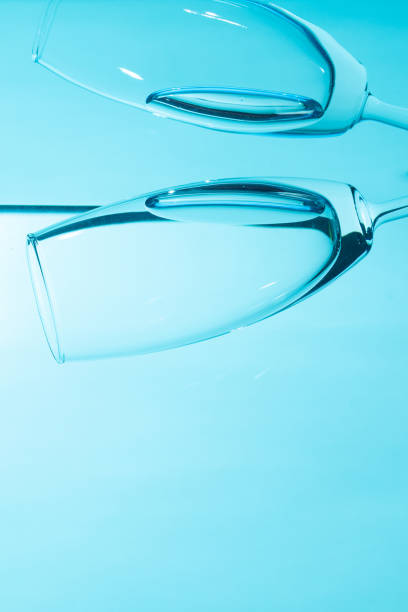 istock Glass in water  isolated on blue background. 2168387829