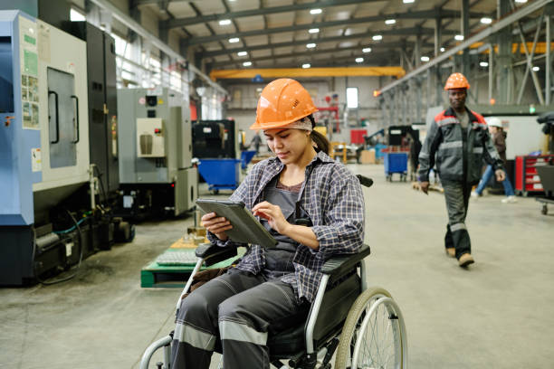 istock Working in Modern Industrial Facility in Wheelchair 2168390019