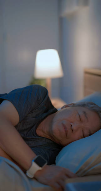 istock old man sleep with smartwatch 2168393115
