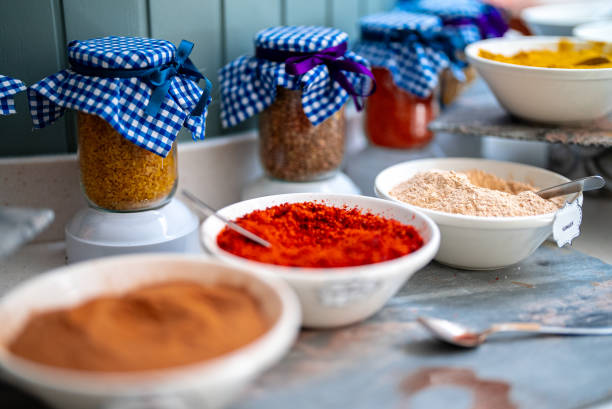 Plates with spices on the table. Turmeric, pepper.