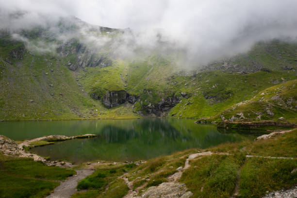 istock Panoramic views on Lake Balea in the Fagaras Mountains, found in the Carpathians when following the scenic Transfăgărășan road (DN7C) 2168397214