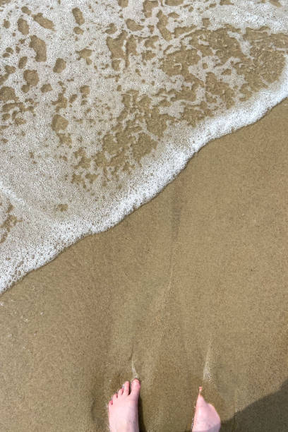 istock foots on sand beach at Curonian Courish Spit 2168397768