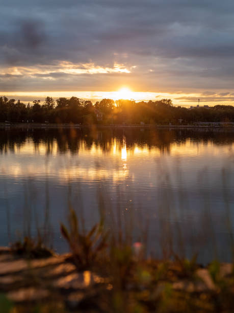 istock warm summer sunset over pond in Kaliningrad city 2168397818