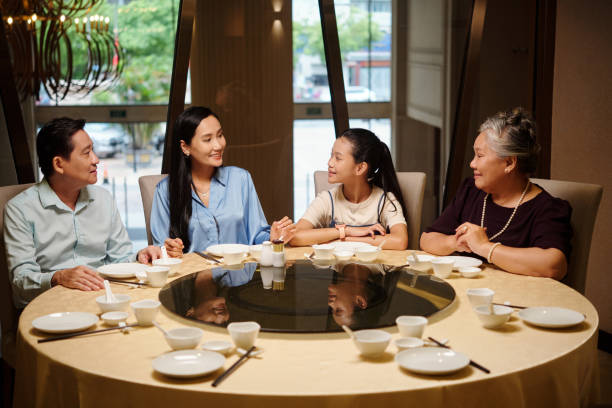 istock Asian Family Sitting At Dining Table 2168398839