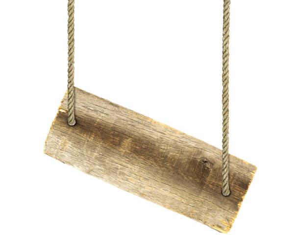istock An old board suspended on a rope. 2168401994