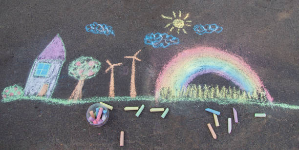 istock a child draws with chalk on the asphalt. beautiful picture. 2168404463