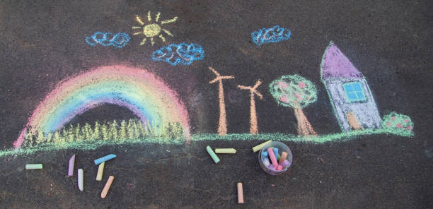 istock a child draws with chalk on the asphalt. beautiful picture. 2168404469