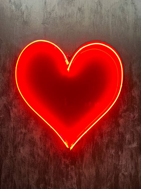 istock Neon red Heart Shape on a red Background, Abstract Valentine's Day Concept 2168405375